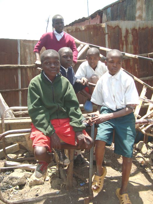 Amos Imbeva in green cardigan with his friends   Sposor Saga