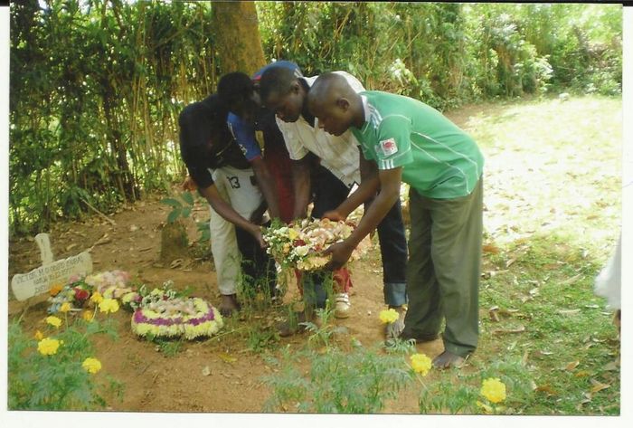 Victor's brother & Friends Laying flower  on grave