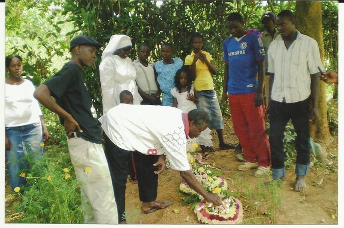 Victor's Dad Laying flower to grave