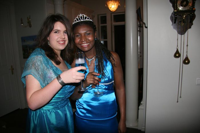 two ladies with a glass