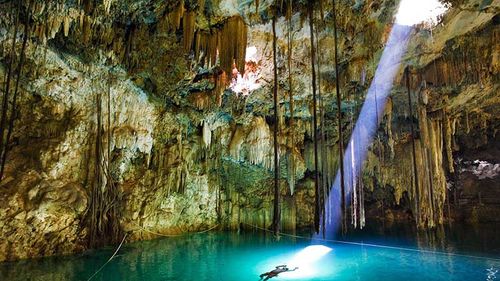 cave light beam azure lake stalactites stalagmites