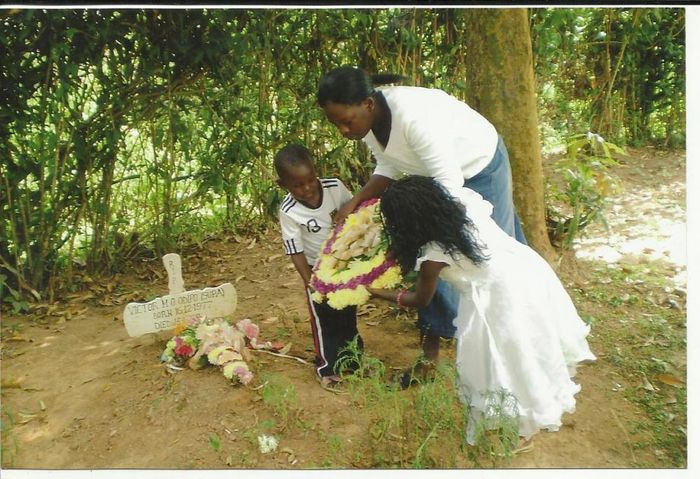 Victor's Widow Celestine  and the two orphans lay flower on the grave
